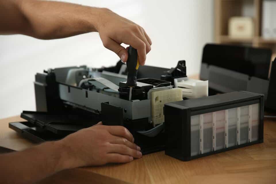 Printer Repair Image by Freepik